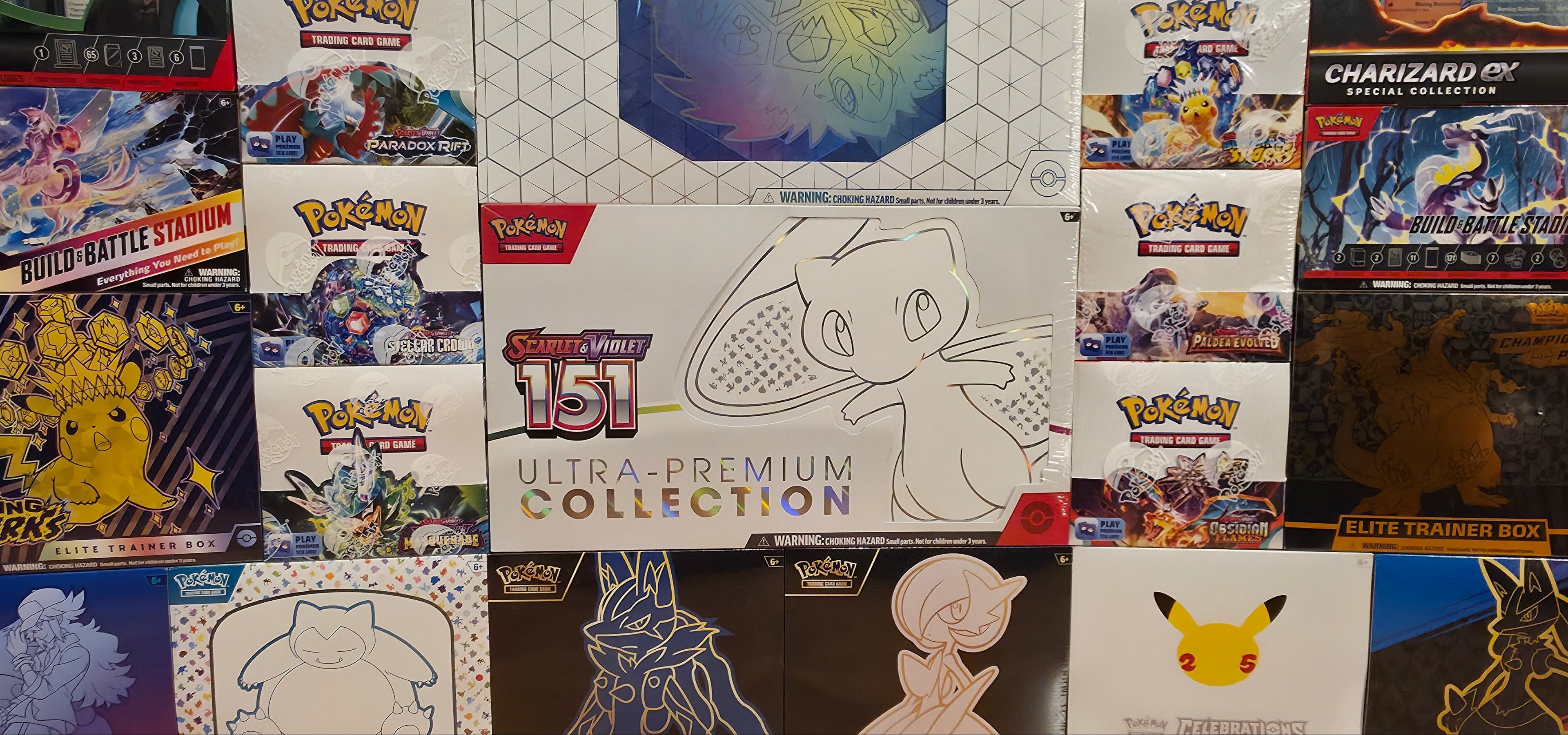 Collection of Pokémon trading card game boxes and packaging.